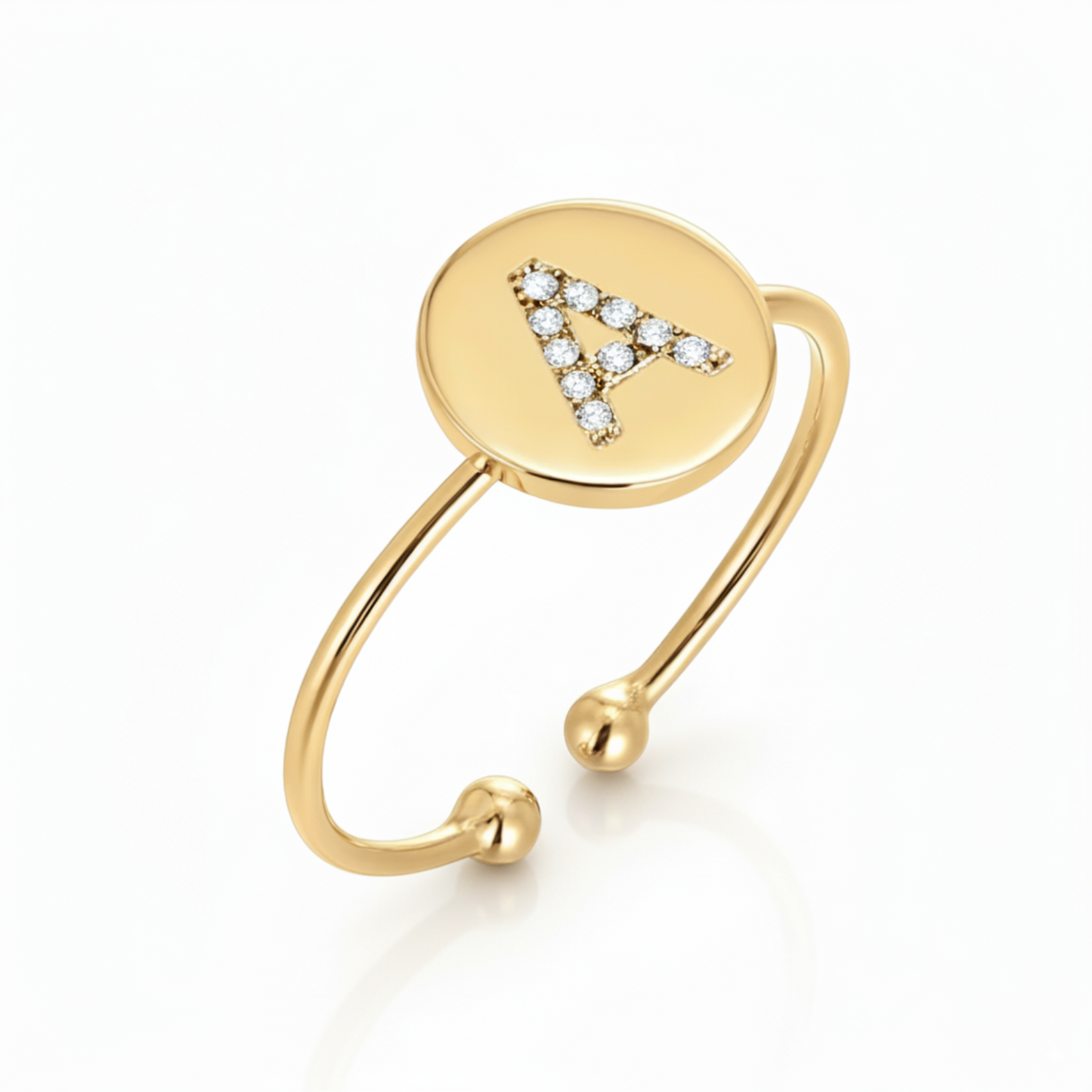 Regulowany pierścionek z literą "Gold Shine"