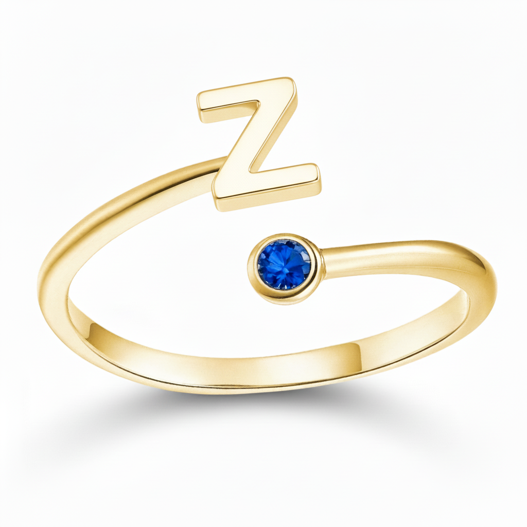 Regulowany pierścionek z literą "Essence"